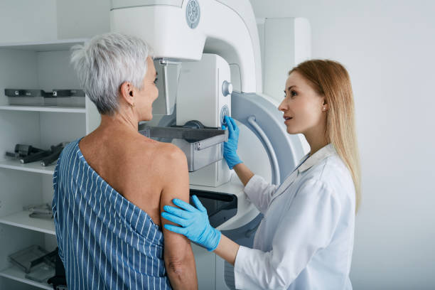 Adult woman getting prep to take a breast cancer test.